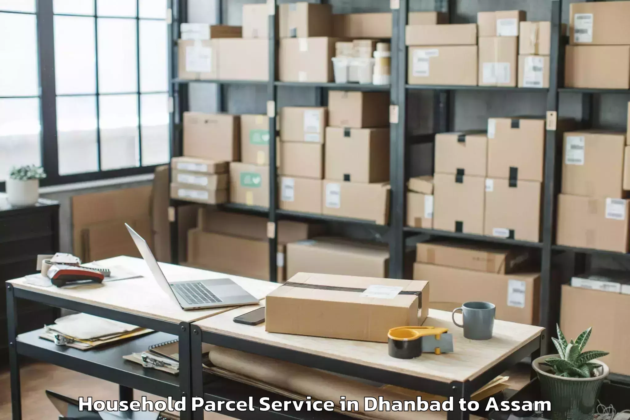 Book Dhanbad to Chariduar Household Parcel Online